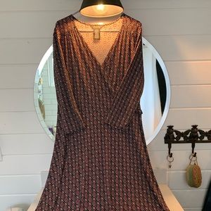 Black red and beige shin length dress.